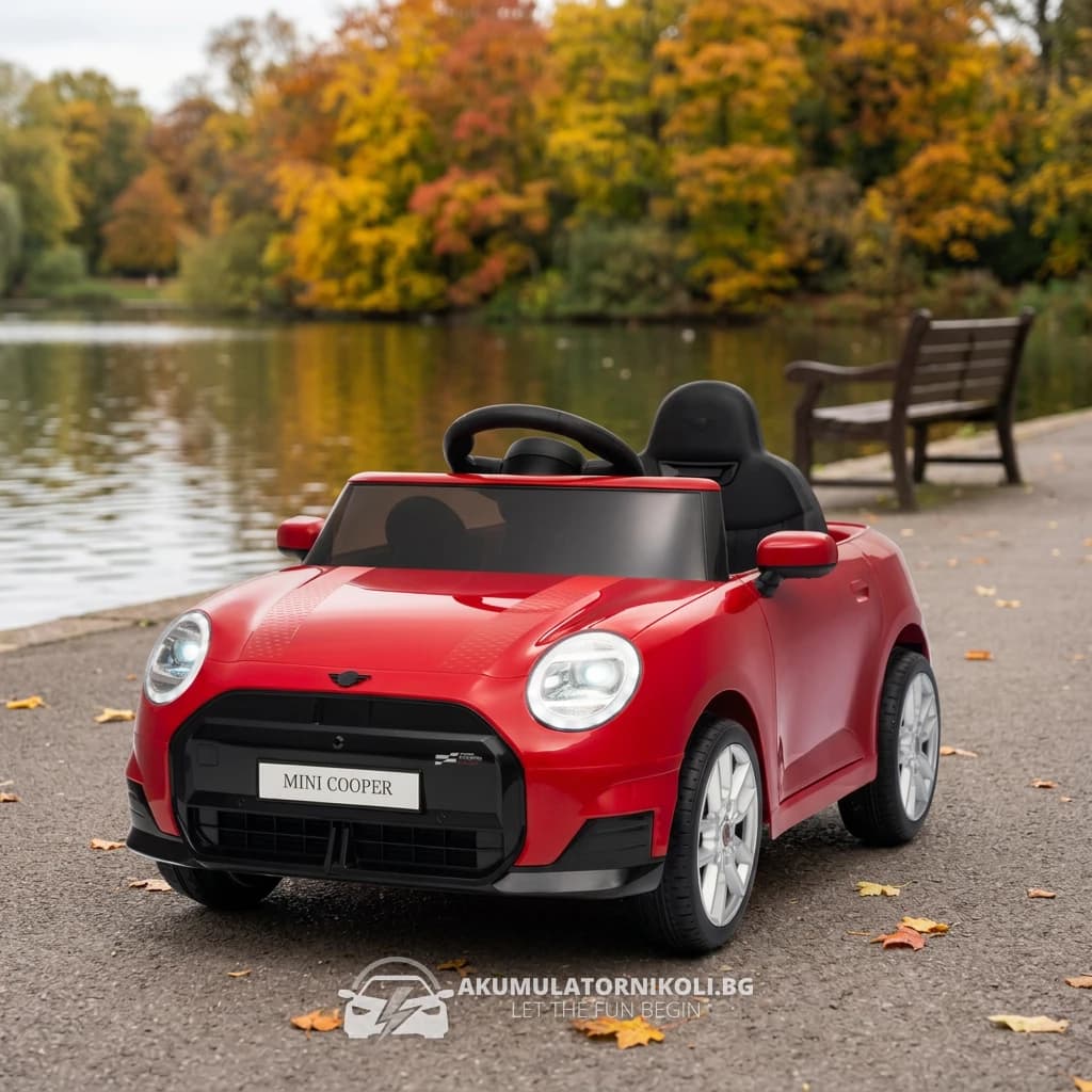 Лицензирана Детска Акумулаторна Кола MINI Cooper, 70W (2×35W), 12V/10Ah, R/C 2.4G, EVA гуми, Червен – отпред отляво, на алеята край езерото в парка, с логото на магазина